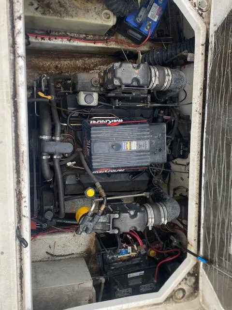 Slide: The Image of Engine compartment of a 1998 Bayliner Ciara 2855 with MerCruiser components. - 14