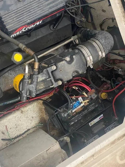 Slide: The Image of Engine compartment of a 1998 Bayliner Ciara 2855 with visible wiring and components. - 16