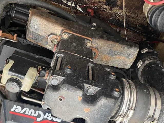 Slide: The Image of Engine components of a 1998 Bayliner Ciara 2855 boat, featuring a MerCruiser system. - 17