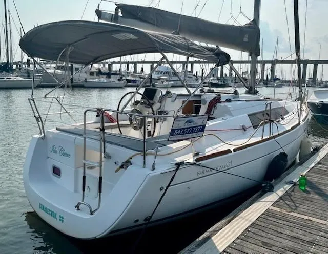 Slide: The Image of 2008 Beneteau Oceanis 31 sailboat docked at marina, rear view. - 12