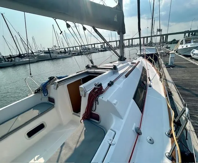 Slide: The Image of 2008 Beneteau Oceanis 31 sailboat docked at marina, showcasing deck and rigging. - 14