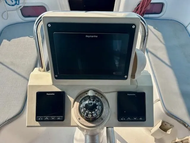 Slide: The Image of Cockpit navigation instruments on a 2008 Beneteau Oceanis 31 sailboat. - 15