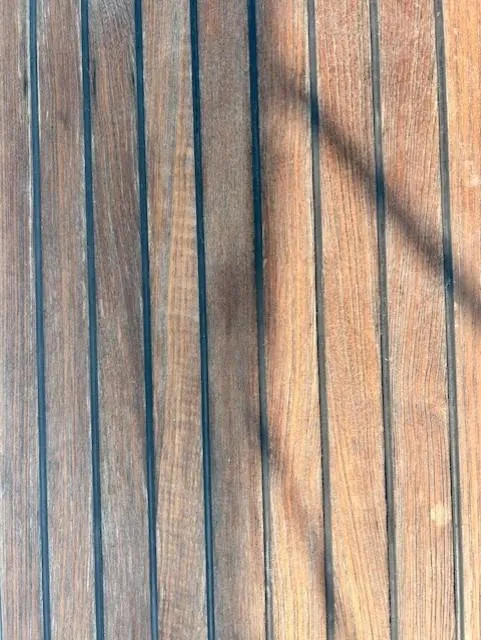 Slide: The Image of Teak deck of 2008 Beneteau Oceanis 31 sailboat with shadow lines. - 16