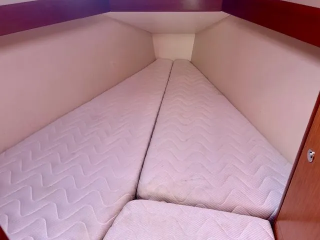 Slide: The Image of Interior cabin of 2008 Beneteau Oceanis 31 with twin mattresses. - 22