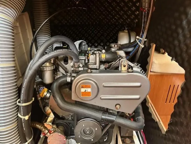 Slide: The Image of Engine compartment of a 2008 Beneteau Oceanis 31 sailboat, showcasing mechanical components. - 25