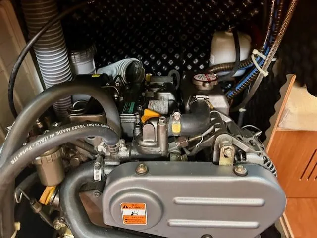 Slide: The Image of Engine compartment of a 2008 Beneteau Oceanis 31 sailboat, showcasing mechanical components. - 26