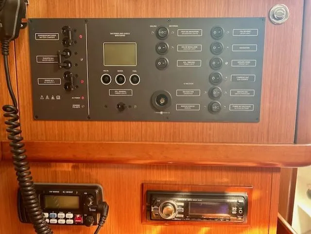 Slide: The Image of Control panel of a 2008 Beneteau Oceanis 31 sailboat with radio and navigation equipment. - 29