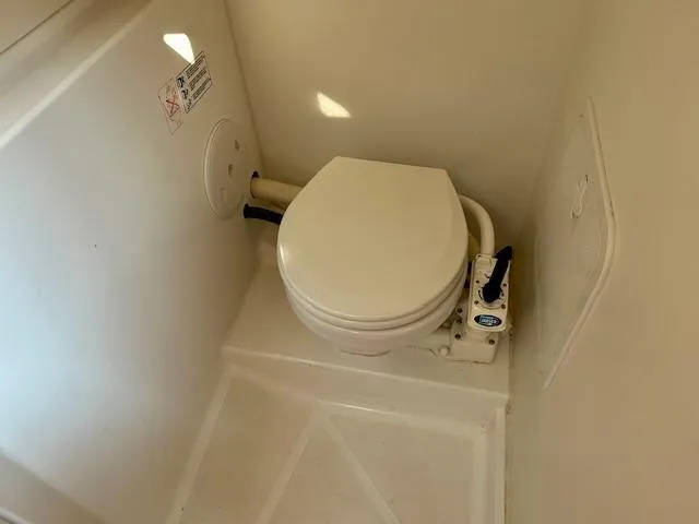 Slide: The Image of Toilet in 2008 Beneteau Oceanis 31 sailboat, compact marine bathroom design. - 32