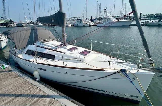 Slide: The Image of 2008 Beneteau Oceanis 31 sailboat docked in a marina, sunny day. - 38