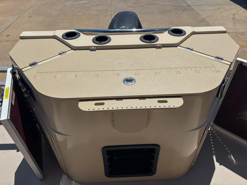 Slide: The Image of 2019 Sweetwater 2186 FS boat console with cup holders and storage compartments. - 12