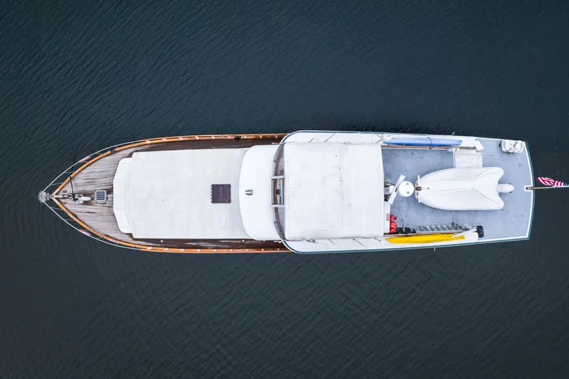 Slide: The Image of Aerial view of a 1980 McQueen Motoryacht on calm water. - 7