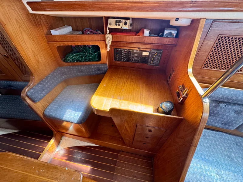 Slide: The Image of Interior of 1984 Camper & Nicholsons Nicholson 35 sailboat with wooden cabinetry and seating. - 11