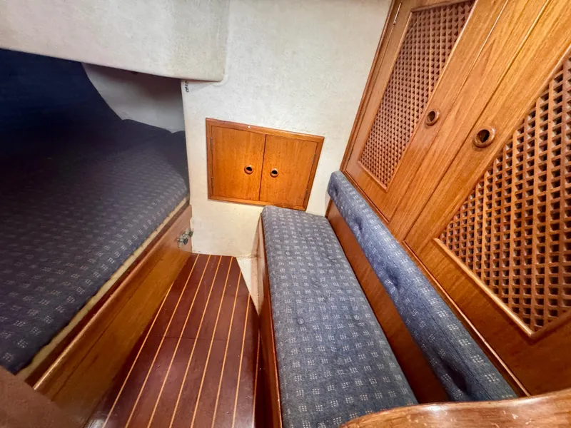 Slide: The Image of Cozy cabin interior of 1984 Camper & Nicholsons Nicholson 35 sailboat with wooden accents. - 13