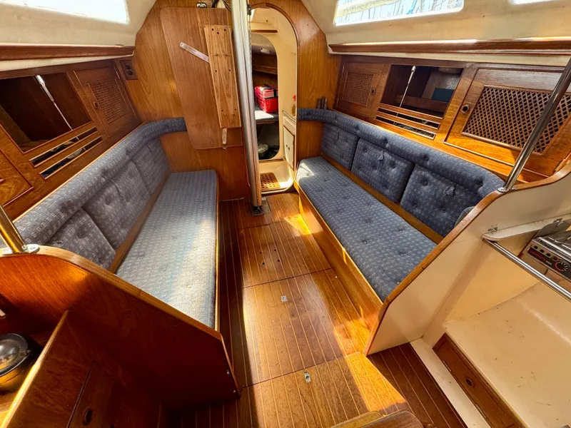 Slide: The Image of Interior cabin of 1984 Camper & Nicholsons Nicholson 35 sailboat with storage items. - 14
