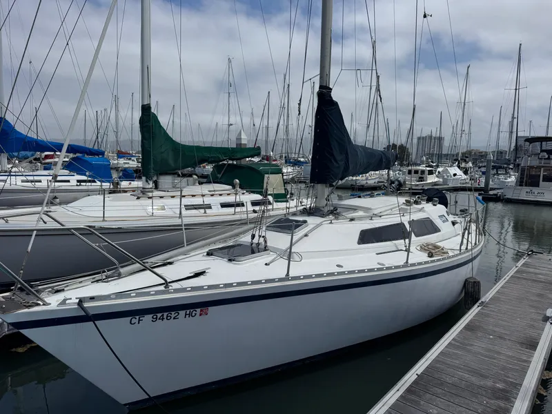 Slide: The Image of 1984 Camper & Nicholsons Nicholson 35 sailboat docked in a marina. - 2