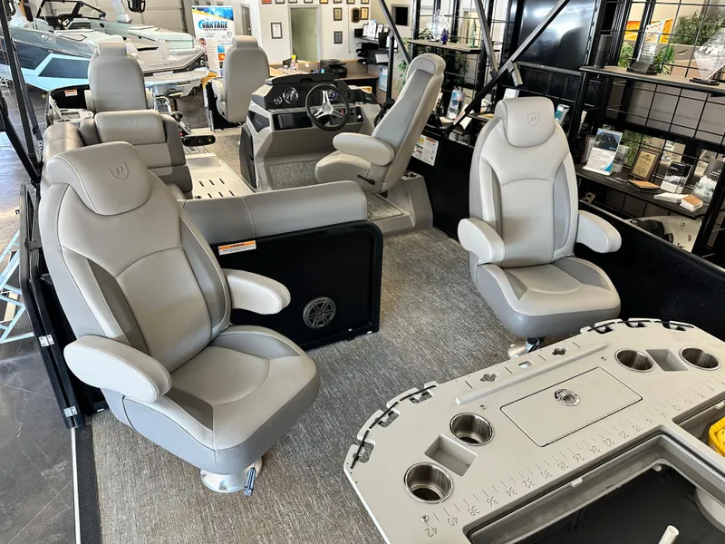 Slide: The Image of 2025 Premier Sunsation 230 Angler interior with luxurious seating and modern dashboard. - 12