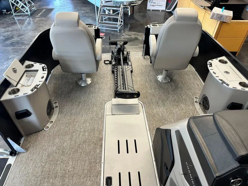 Slide: The Image of 2025 Premier Sunsation 230 Angler interior with seating and fishing rod holder. - 6