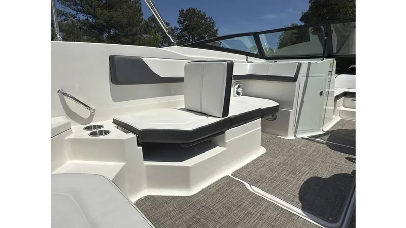 Slide: The Image of 2016 Sea Ray SPX 210 boat interior with cushioned seating and modern design. - 11