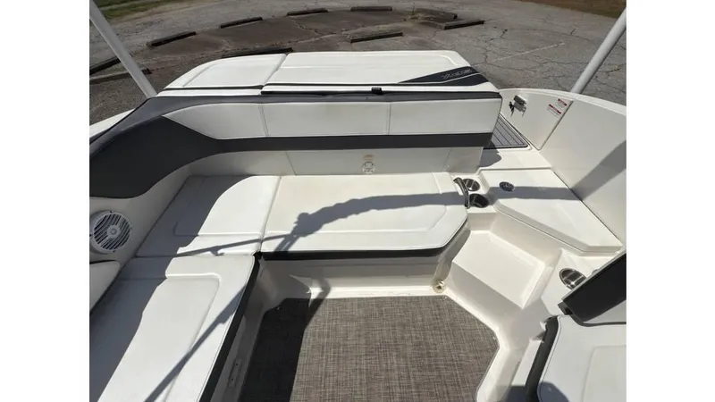 Slide: The Image of 2016 Sea Ray SPX 210 boat interior with white seating and gray accents. - 5