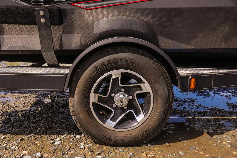 Slide: The Image of 2020 Ranger VS1660 SC trailer wheel on muddy ground, close-up view. - 10