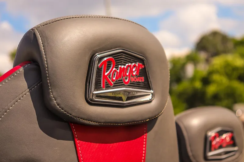 Slide: The Image of 2020 Ranger VS1660 SC boat seat with logo, featuring gray and red upholstery. - 12