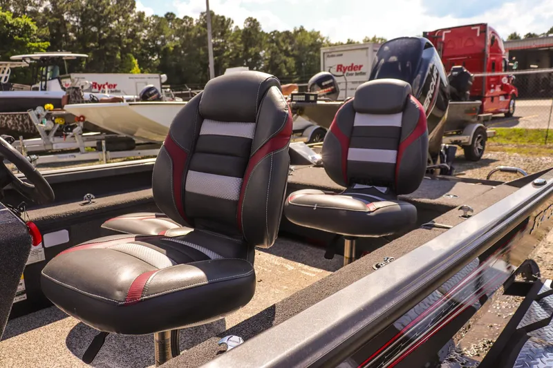 Slide: The Image of 2020 Ranger VS1660 SC boat seats with black and red accents in a sunny outdoor setting. - 14
