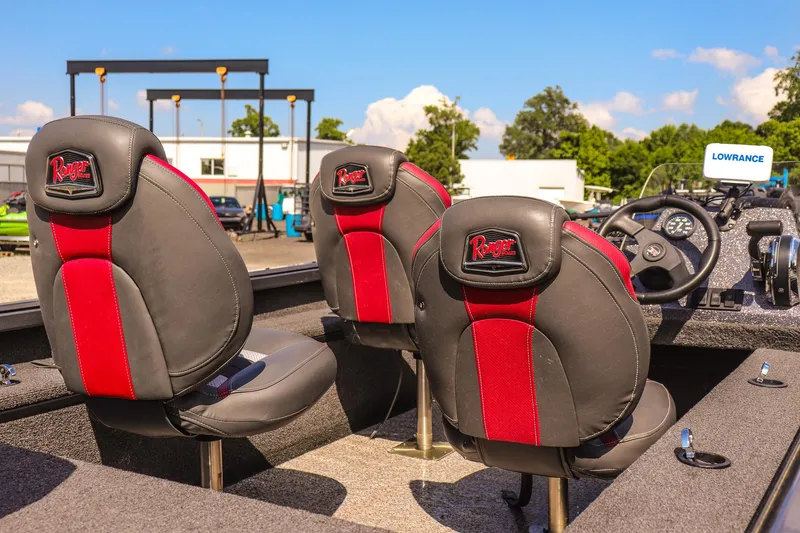 Slide: The Image of 2020 Ranger VS1660 SC boat interior with red and black seats, steering wheel, and Lowrance equipment. - 17