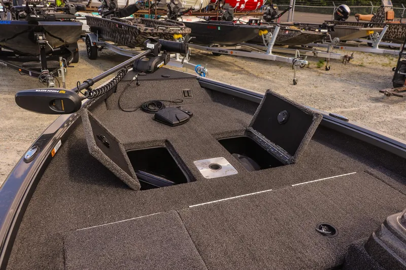 Slide: The Image of 2020 Ranger VS1660 SC boat deck with storage compartments and trolling motor. - 19