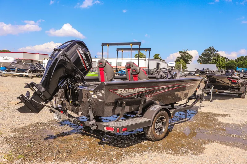 Slide: The Image of 2020 Ranger VS1660 SC boat with Mercury outboard motor on a trailer. - 2