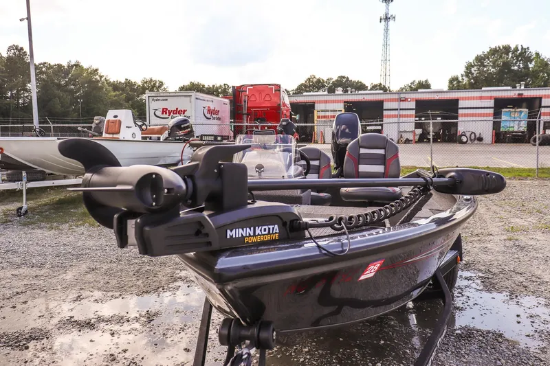 Slide: The Image of 2020 Ranger VS1660 SC boat with Minn Kota PowerDrive motor in a parking lot. - 20