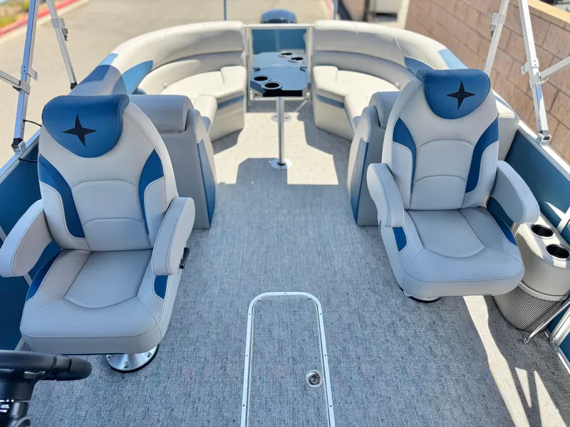 Slide: The Image of 2025 Berkshire 22RFX LE pontoon boat interior with plush seating and cup holders. - 11