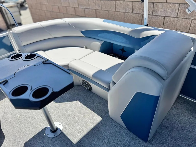 Slide: The Image of 2025 Berkshire 22RFX LE pontoon boat interior with plush seating and cup holders. - 15