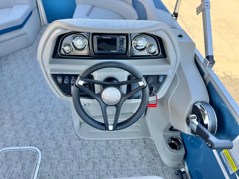 Slide: The Image of 2025 Berkshire 22RFX LE boat dashboard with steering wheel and control panel. - 19