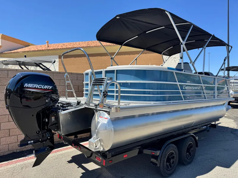 Slide: The Image of 2025 Berkshire 22RFX LE pontoon boat with Mercury engine on trailer. - 5