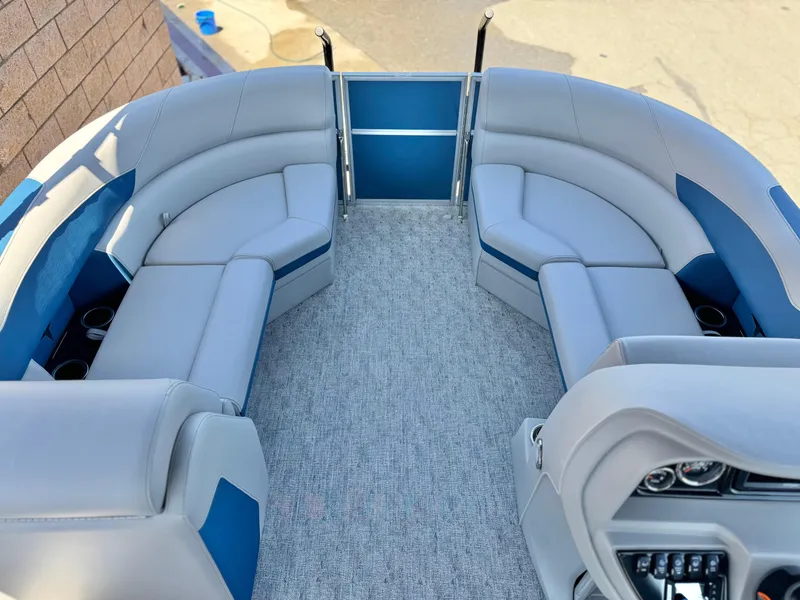 Slide: The Image of 2025 Berkshire 22RFX LE pontoon boat interior with gray and blue seating. - 8