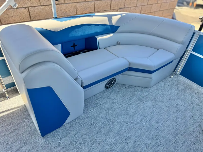 Slide: The Image of 2025 Berkshire 22RFX LE boat interior with blue and gray seating, modern design. - 9