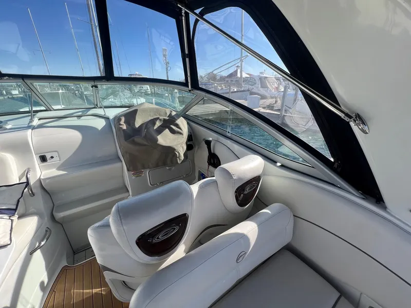 Slide: The Image of Interior of 2008 Crownline 270 CR boat with white seating and helm station. - 10