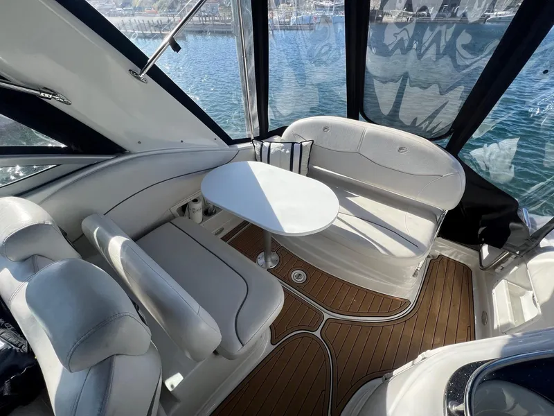 Slide: The Image of 2008 Crownline 270 CR boat interior with white seating and wooden flooring. - 15
