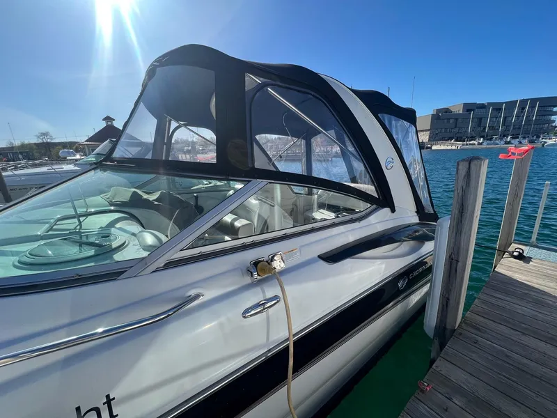 Slide: The Image of 2008 Crownline 270 CR boat docked under clear blue sky. - 5