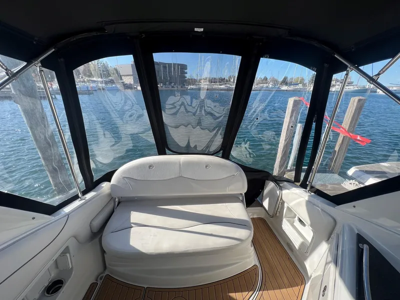 Slide: The Image of Interior view of 2008 Crownline 270 CR boat with seating and waterfront backdrop. - 8