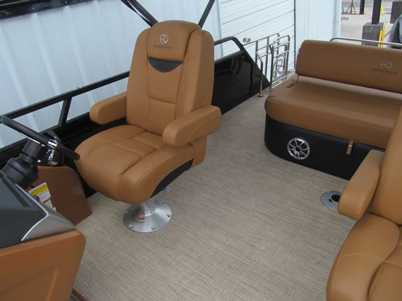 Slide: The Image of Luxurious interior of 2022 Regency 250 LE3 Sport boat with tan leather seating. - 16