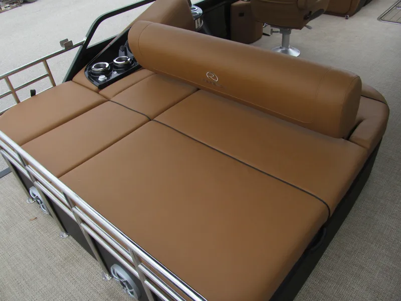 Slide: The Image of 2022 Regency 250 LE3 Sport boat with brown cushioned seating and cup holders. - 7