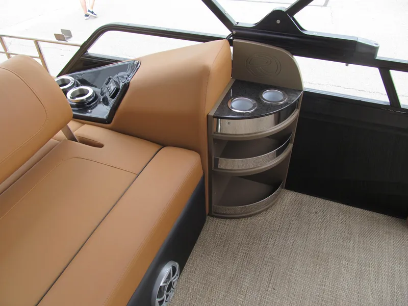 Slide: The Image of Interior of 2022 Regency 250 LE3 Sport boat with tan seating and cup holders. - 8