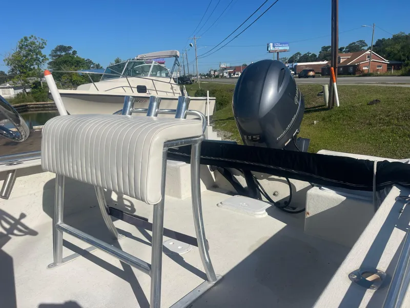 Slide: The Image of 2018 May-Craft 22 Cape Classic boat with Yamaha outboard motor, docked outdoors. - 4