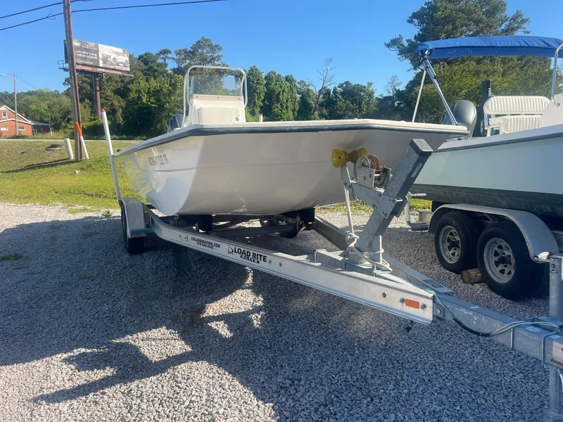 Slide: The Image of 2018 May-Craft 22 Cape Classic boat on trailer, parked on gravel lot. - 9