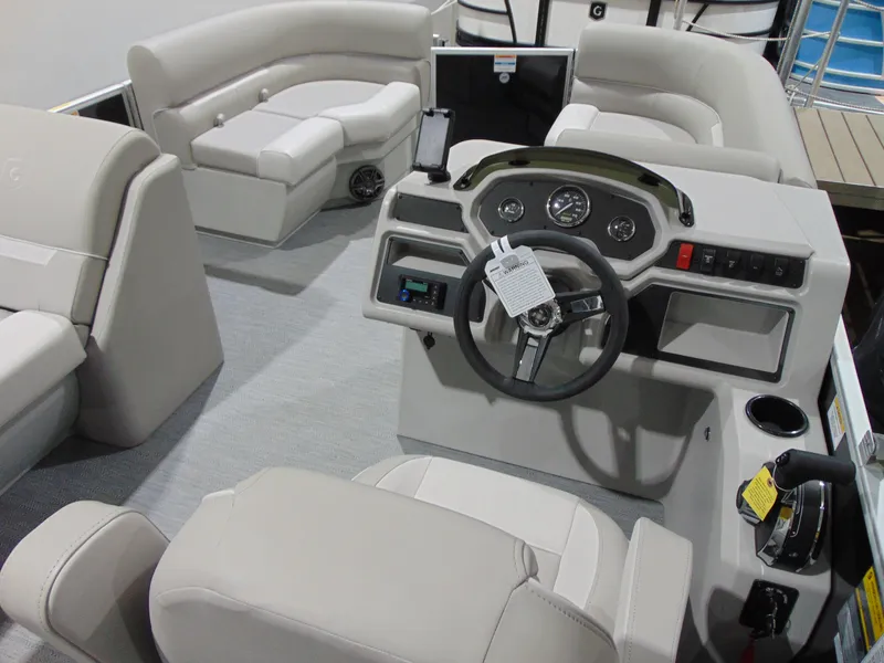 Slide: The Image of Interior of 2025 Godfrey EX 1680 CX boat with modern steering console and seating. - 11