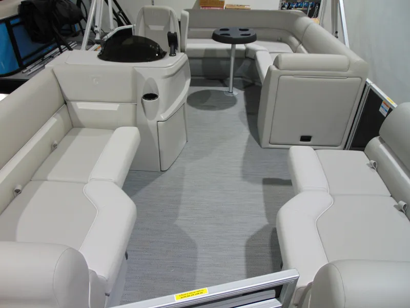 Slide: The Image of Interior of 2025 Godfrey EX 1680 CX pontoon boat with spacious seating and table. - 3