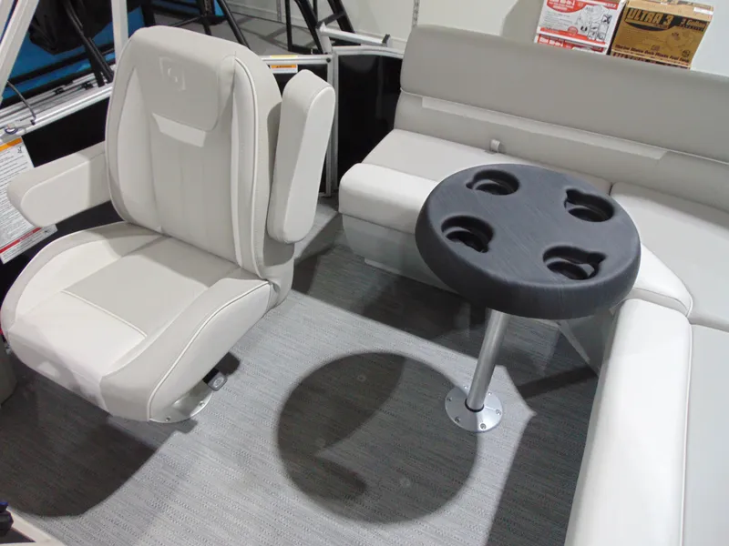 Slide: The Image of 2025 Godfrey EX 1680 CX boat interior with seating and cup holder table. - 5