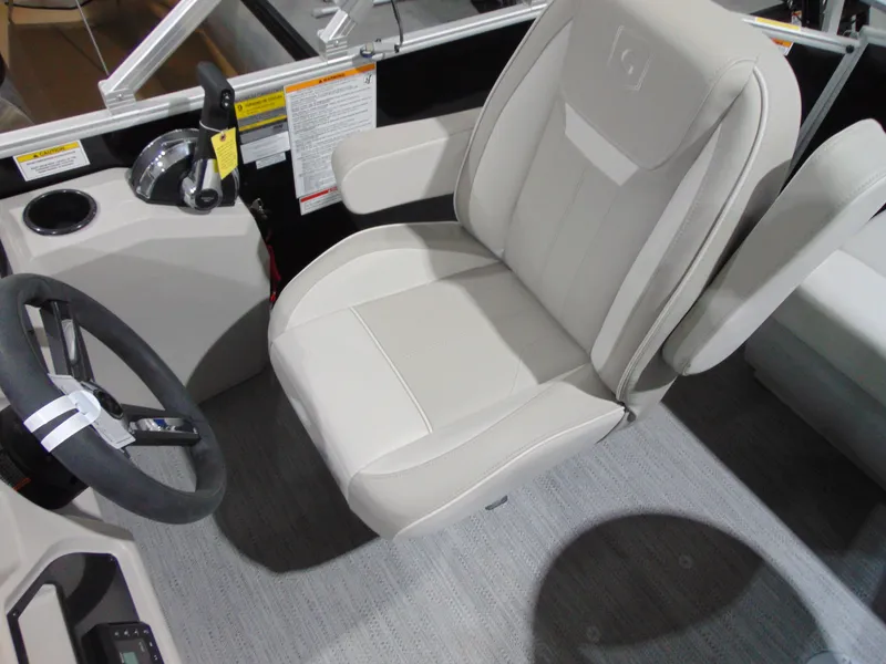 Slide: The Image of Captain's seat of 2025 Godfrey EX 1680 CX boat, featuring a steering wheel and control panel. - 8