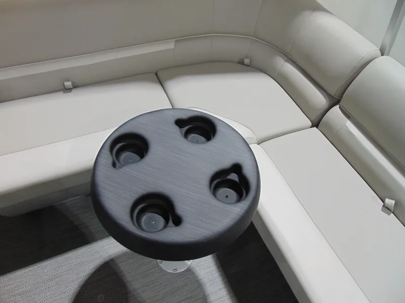 Slide: The Image of Luxurious seating area with cup holder on a 2025 Godfrey EX 1680 CX boat. - 9